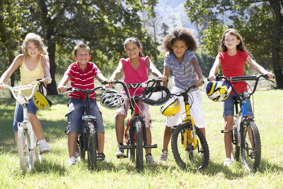 Group Of Children Riding Bikes